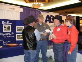Cordell, James and Adam talking with a customer